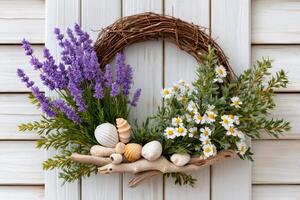 Lavender and chamomile decorating a grapevine wreath on white wooden background photo