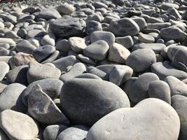Sea stones background. Colorful small pebbles or stone in garden. Flat lay of sea stones texture background. Abstract shape pattern from nature. photo