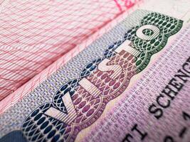 Visa in passport for world travel, EU visa for Italy, tour, airport, customs, news, closed borders, nationality. Macro photo
