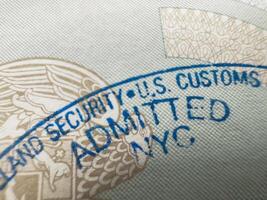 Stamping your passport at the customs border at New York airport, US visa, tour, airport, customs, news, closed borders, nationality. Macro photo