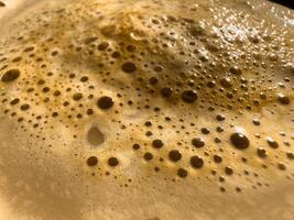 Coffee foam extreme close-up texture background photo