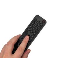 White male hand on white background presses buttons on TV remote control, man switches TV channels with remote control, for banners, for TV advertising. Copy space, flay lay photo