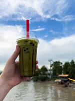 Bubble mil tea, iced matcha latte. Berry refreshing cocktail. Background with selective focus and copy space for text, vertical photo