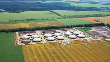New factory among beautiful nature. Plant for biogas production on fields. Modern complex is equipped with its own biogas. Aerial view. video