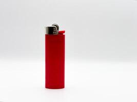 Red plastic lighter on a white background in full length side view photo