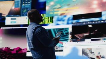 Black social media manager engaging with social network trends on screens, showcasing user interface and digital web platforms. Power of technology, influence and internet connection. Camera B. video