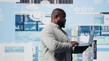 Business expert reviewing digital dashboard with finance models and projections, working on strategic planning with infographics on gadget. Corporate economy management and analysis. Camera A. video