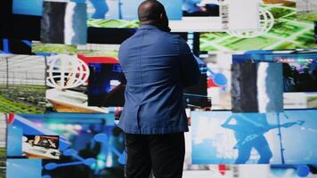 Modern black creator exploring digital world through web platforms, reflecting trends in social media, sharing and user interface design within immersive online environment. Camera A. video