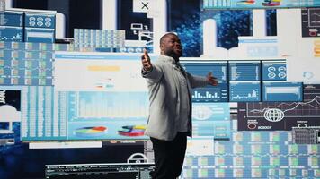 African american public speaker business coach hosting dynamic presentation with a live audience, building new fruitful strategy at a convention. Ideas and forecasting in business event. Camera A. video
