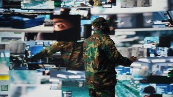 Black soldier guiding troops with satellite coordinates to create tactics, high tech control center for a mission. Soldier transmitting threat detection insight for national safety. Camera A. video
