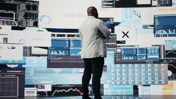 Male business leader analyzing finance charts and analytics for startup development, performance models for fruitful management decisions. Administrator studying big data reports. Camera A. video
