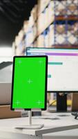 Vertical Warehouse employee in hi vis vest uses copy space display with technology of shipping software, packaging systems and inventory management tools. E-commerce logistics. Camera A. video