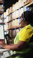 Vertical Customer support employee handles e-commerce order issues on a call, responding to clients and helping with information about shipment delays or wrong delivery addresses. Camera A. video
