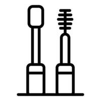 Mascara brush and tube standing on a surface, makeup tool icon vector
