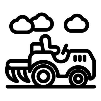 Small tractor plowing agricultural land under cloudy sky