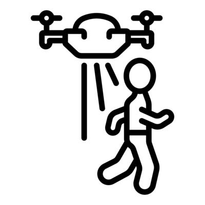 Drone tracking running person with light beam, innovation in surveillance technology