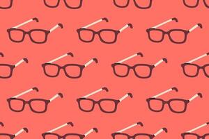Seamless pattern with reading glasses on coral background, great for school, creativity, and learning themes vector