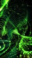 Bright sparkling green neon light waves on dark background. Futuristic abstraction video