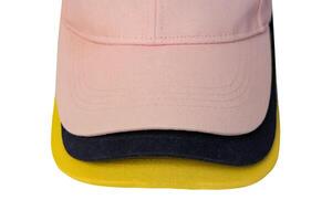 Yellow, blue, pink cap visors isolated on white background. Mockup for design placement. photo