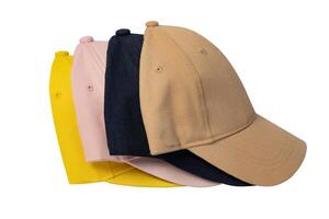 Pink, blue, yellow and beige cap, side view, isolated on white background. Four caps stacked one after another, mockup for logo placement. photo