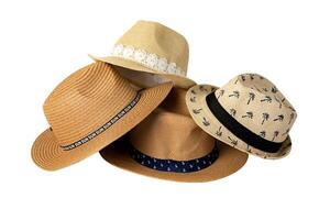 Set of stylish straw hats cut out on white background. Stylish summer headwear for traveling on the beach during vacation. photo