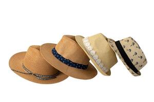 Set of stylish straw hats isolated on white background with space for text. Stylish summer headdress for beach travel during vacation. photo