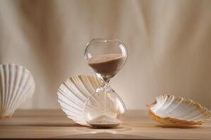 A sophisticated display featuring a delicate hourglass surrounded by elegant seashells, emphasizing the blend of minimalism, creative design, and coastal aesthetics for unique and timeless concept photo