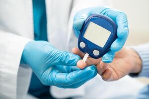 diabetes from finger blood sugar level finger lancet. photo