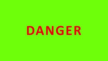 Danger flashing red text on a green screen background, pulsating letters emphasize urgency and caution video
