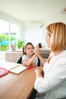 Joyful interaction between child and adult in bright room photo