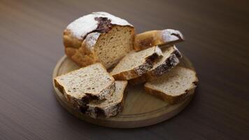 Looping animation around a composition of loaf cake lying on a wooden board. Loop motion. Defocus. video