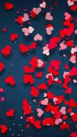 Looped animation of pink and red hearts moving in a circular flow on a dark blue background. Perfect for romantic projects, backgrounds, and love-themed celebrations. Cycle animation. video
