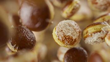 Animation of a group of donuts. Many donuts slowly rotate in the background in space. Horizontal composition. Defocus. Close-up. video