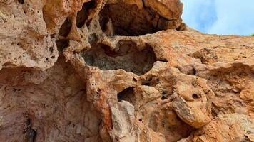 A closeup view of a uniquely textured rock formation that vividly showcases stunning and intricate natural details video