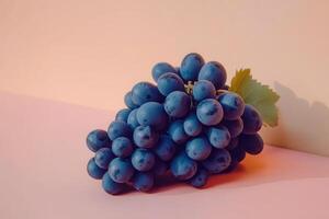 Fresh Grapes on Soft Peach Table Surface photo