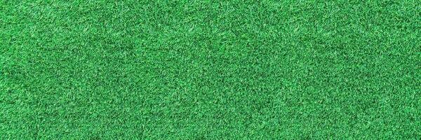 horizontal artificial green grass for pattern and background photo
