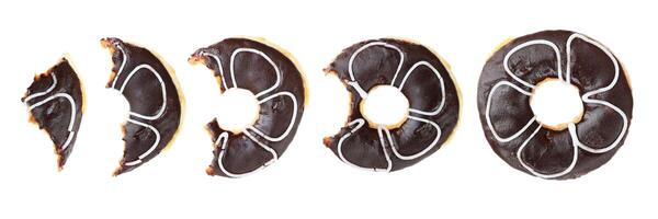 donuts with missing bite isolated on white photo