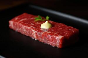 Exquisite wagyu beef with parsley and sauce on elegant black plate photo