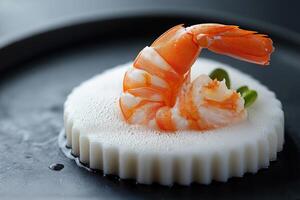 Cooked shrimp lying on a round white dish with air bubbles photo