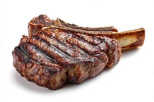 Perfectly seared cowboy bone in steak on white background with rustic presentation photo