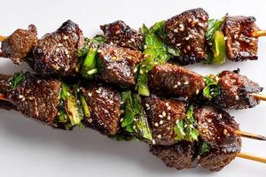 High quality photo of grilled Mongolian beef skewers isolated on clean white background