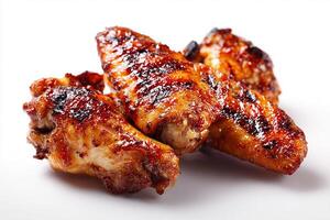 Realistic grilled chicken wings coated with sticky BBQ glaze on white background photo