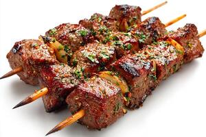 Realistic grilled garlic beef kababs served on white background with fresh herbs photo