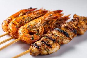High quality photo of mixed grilled shrimp and chicken skewers isolated on white