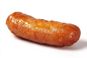 Delicious deep fried battered sausage freshly cooked with crispy golden brown coating photo