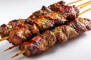 Realistic grilled Moroccan beef skewers served on white background close up view photo