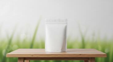 A white bag on a wooden table with grass in the background photo