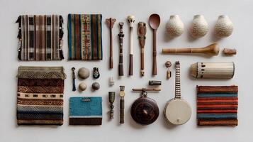 Collection of Traditional Handmade Textiles and Cultural Artifacts Displayed on White Background photo