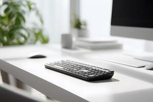 Minimalist White Office Desk with Wireless Keyboard and Computer Monitor in Bright Natural Light photo