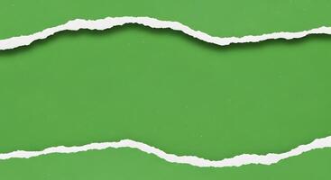 Torn Green Paper Background, Abstract Texture with Irregular Edges and White Reveal photo